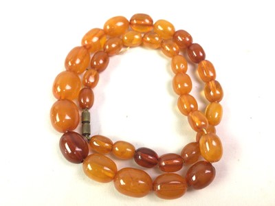 Lot 382 - STRING OF CHERRY-AMBER-COLOURED BAKELITE-EFFECT BEADS