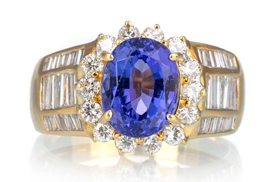 Lot 504 - TANZANITE AND DIAMOND RING