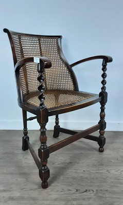 Lot 574 - OAK CANE PANELLED ELBOW CHAIR