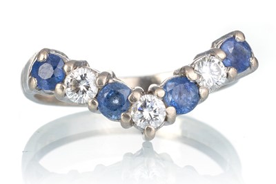 Lot 558 - DIAMOND AND SAPPHIRE WISHBONE RING