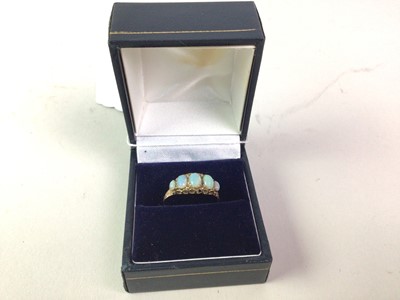 Lot 33 - OPAL FIVE STONE RING