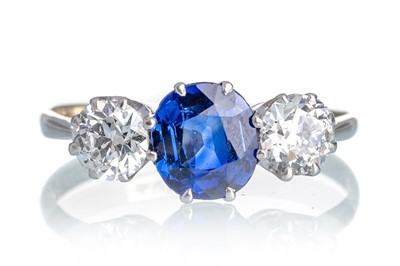 Lot 564 - SAPPHIRE AND DIAMOND THREE STONE RING