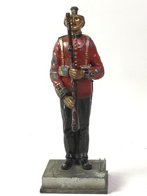 Lot 294 - OLD PAINTED TABLE LIGHTER MODELLED AS A SOLDIER