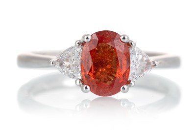 Lot 569 - ORANGE SAPPHIRE AND DIAMOND RING