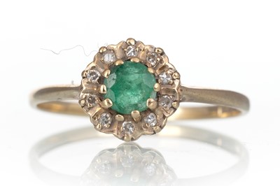 Lot 667 - EMERALD AND DIAMOND CLUSTER RING