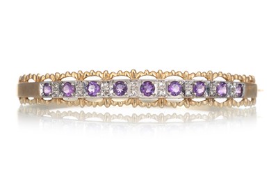 Lot 674 - AMETHYST AND DIAMOND BANGLE