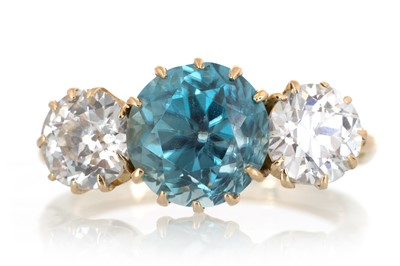 Lot 554 - ZIRCON AND DIAMOND THREE STONE RING