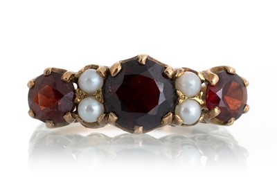 Lot 714 - GARNET AND SEED PEARL BOAT SHAPED RING