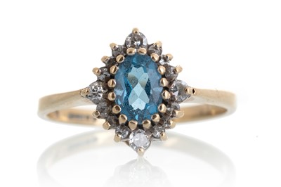 Lot 608 - TOPAZ AND DIAMOND RING