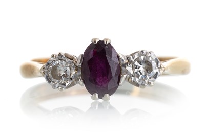 Lot 610 - GEM SET AND DIAMOND THREE STONE RING