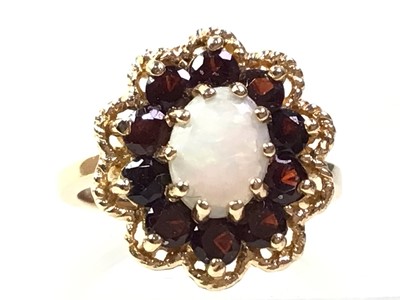 Lot 584 - BIRKS GARNET AND OPAL RING