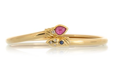 Lot 631 - RUBY, SAPPHIRE AND DIAMOND SNAKE BANGLE