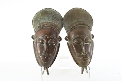 Lot 239 - PAIR OF AFRICAN CAST COPPER BAULE MASKS