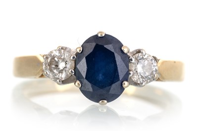 Lot 698 - SAPPHIRE AND DIAMOND THREE STONE RING