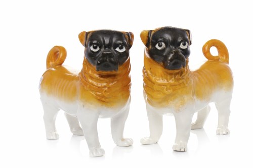 Lot 474 - PAIR OF MID 20TH CENTURY PUG DOGS in white and...