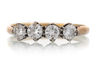 Lot 462 - DIAMOND FOUR STONE RING