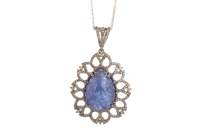 Lot 565 - TANZANITE AND DIAMOND PENDANT