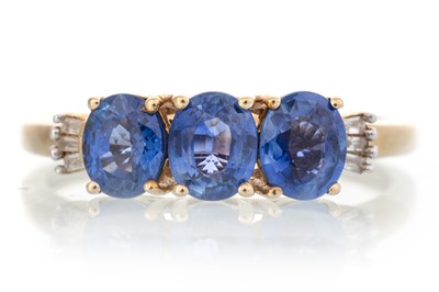 Lot 594 - SAPPHIRE AND DIAMOND THREE STONE RING