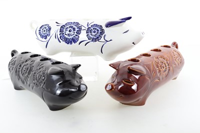 Lot BESWICK, THREE CANDLE HOLDERS MODELLED AS PIGS