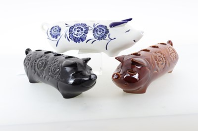 Lot 1374 - BESWICK, THREE CANDLE HOLDERS MODELLED AS PIGS