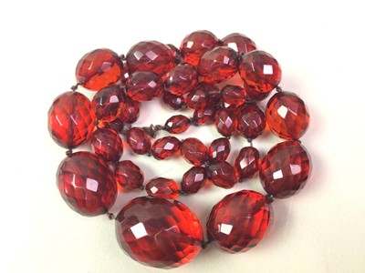 Lot 474 - TWO CHERRY AMBER BAKELITE BEAD NECKLACES