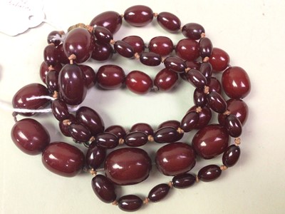 Lot 478 - TWO CHERRY AMBER BAKELITE BEAD NECKLACES