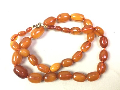 Lot 479 - THREE BUTTERSCOTCH AMBER NECKLACES