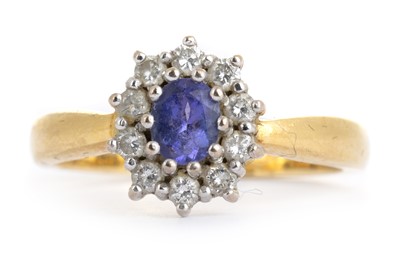 Lot 403 - TANZANITE AND DIAMOND RING