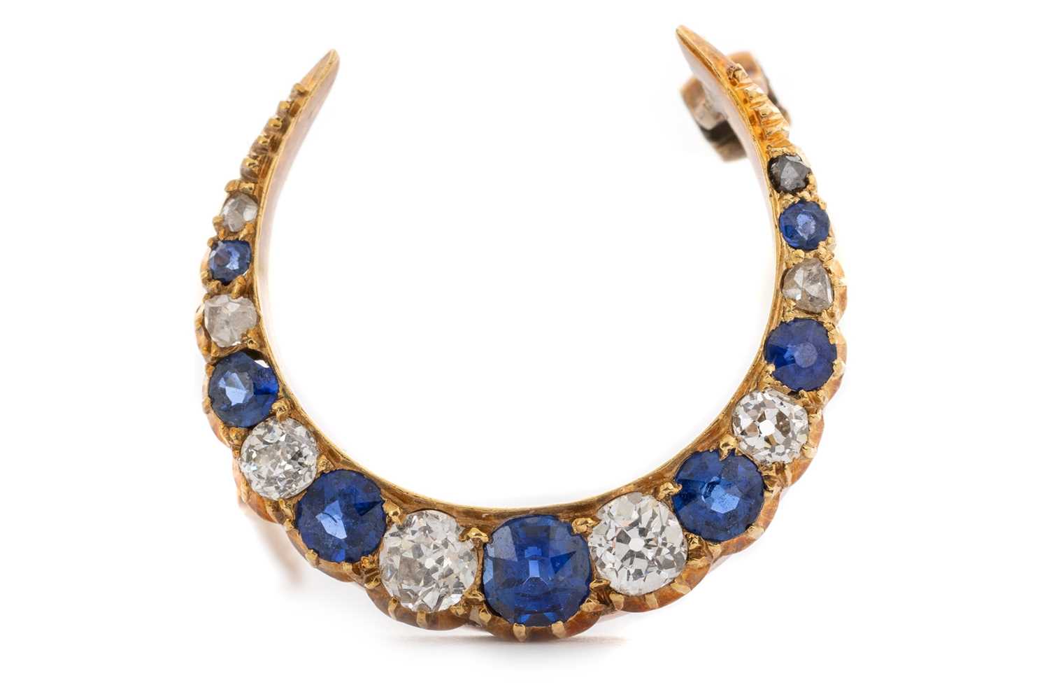 Lot 409 - VICTORIAN SAPPHIRE AND DIAMOND CRESCENT BROOCH