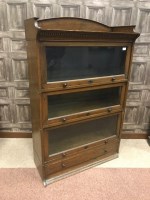 Lot 827 - OAK SECTIONAL BOOKCASE the galleried top with...