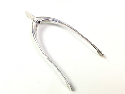 Lot 318 - PAIR OF GEORGE V SILVER SUGAR NIPS