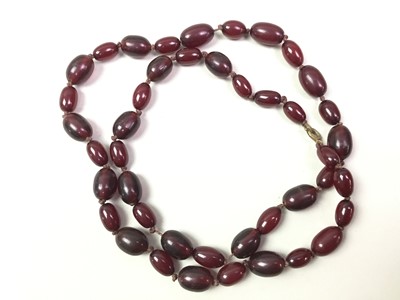Lot 195 - TWO CHERRY AMBER BAKELITE NECKLACES