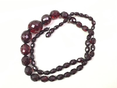 Lot 337 - TWO CHERRY AMBER BAKELITE NECKLACES