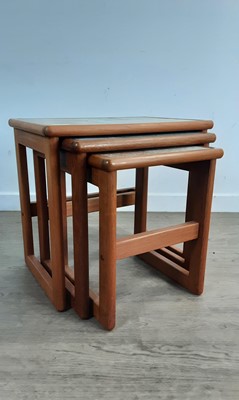Lot 147 - TILE TOPPED NEST OF THREE TABLES