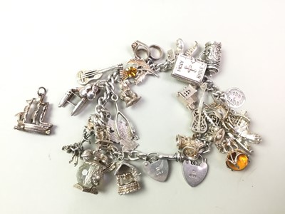 Lot 454 - SILVER CHARM BRACELET
