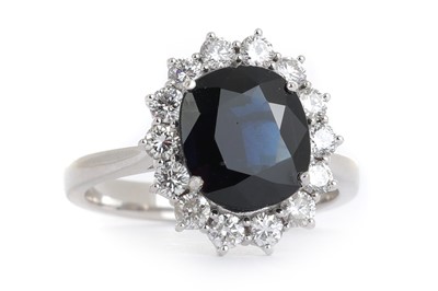 Lot 412 - SAPPHIRE AND DIAMOND CLUSTER RING