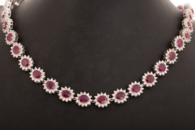 Lot 431 - IMPRESSIVE RUBY AND DIAMOND CLUSTER NECKLACE