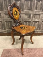 Lot 1005 - BLACK FOREST WALNUT HALL CHAIR decorated with...