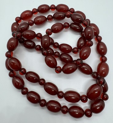 Lot 119 - THREE CHERRY AMBER BAKELITE BEAD NECKLACES