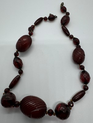 Lot 119 - THREE CHERRY AMBER BAKELITE BEAD NECKLACES