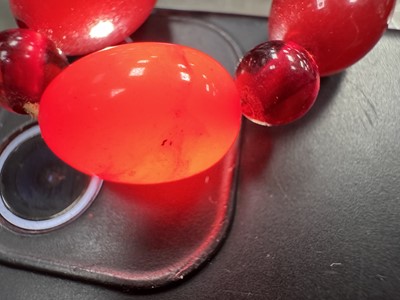 Lot 119 - THREE CHERRY AMBER BAKELITE BEAD NECKLACES