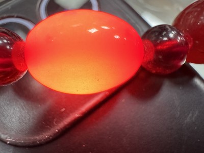 Lot 119 - THREE CHERRY AMBER BAKELITE BEAD NECKLACES