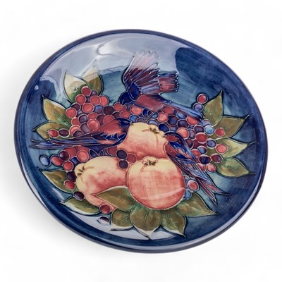 Lot 1671 - SALLY TUFFIN FOR MOORCROFT POTTERY, 'FINCHES AND FRUIT' PATTERN CHARGER