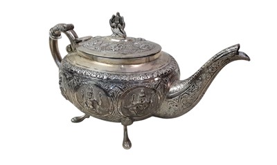 Lot 87 - INDO-TIBETAN WHITE METAL THREE PIECE TEA SERVICE