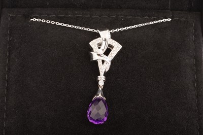 Lot 582 - AMETHYST AND DIAMOND PENDANT