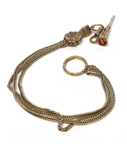 Lot 54 - GOLD CHAIN WITH GEM SET APPENDAGE the curb...
