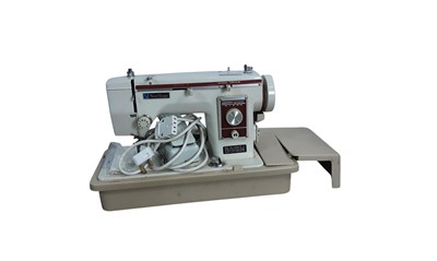 Lot 551 - NEW HOME PORTABLE ELECTRIC SEWING MACHINE