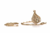 Lot 127 - LOCKET ON CHAIN the unmarked pear shaped...