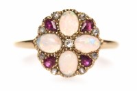Lot 142 - RUBY AND OPAL DRESS RING the round bezel grain...