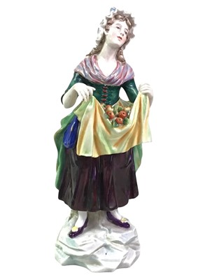 Lot 811 - FIGURE OF A WOMAN CARRYING FRUIT IN AN APRON